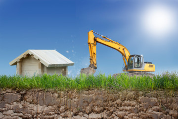 Obraz premium Bagger schaufelt Loch für ein Haus