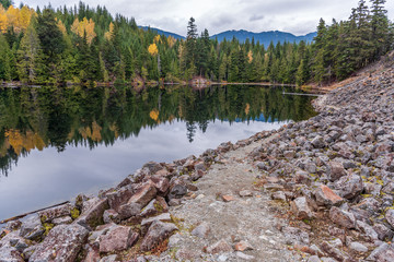 View at Mountain Lake with Dramatic Clouds in British Columbia, Canada.