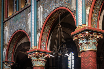 Colorful church interior with pillars and artwok