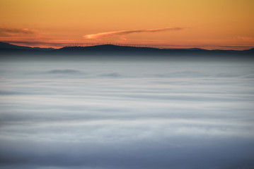 Fototapeta na wymiar Sea of Fog under a Golden Sunrise