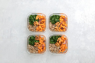 Sauteed kale, quinoa and roasted sweet potato lunch box bowl