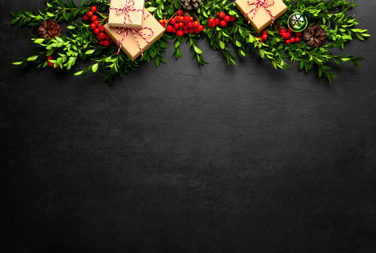 Noel or Christmas dark background with gift boxes