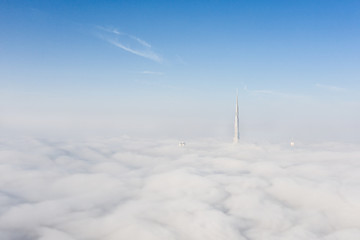 Cityscape of Dubai Downtown skyline on an extremely foggy day when most of world's tallest...