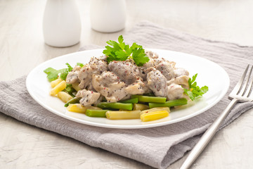 Chicken hearts cooked in a thick creamy sauce.