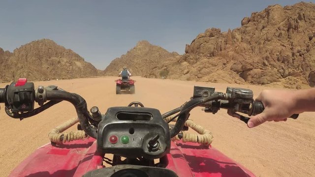 quad bike rides through the desert, action cam view