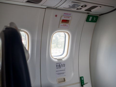 Emergency exit doors on the plane with the door opening method
