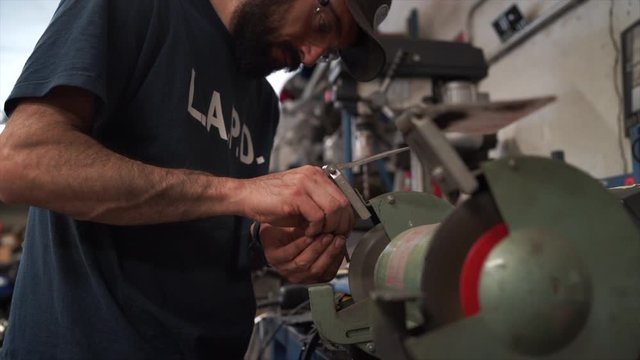 Man working on a motorbike customization. Mechanic concept.