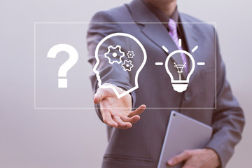 Businessman presses button idea process business progress icon on virtual electronic user interface.