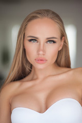 portrait of sexy blonde woman with long hair in linerie