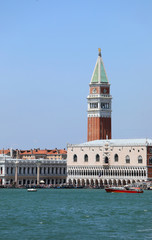 Fototapeta na wymiar Bell Tower of Saint Mark and Ducal Palace also called Palazzo Du