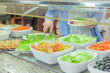 Variety of juicy and colorful vegetables cooked and served in white cups.