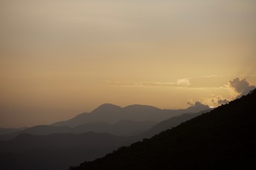 dramatic sunset in mountains of dominican republic with a sliver of sunshine