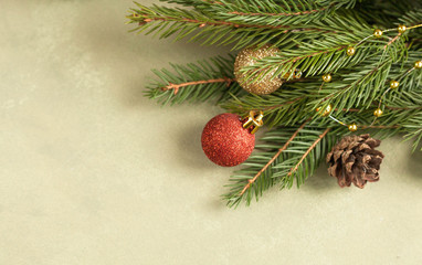Christmas festive background with christmas tree branches and xmas gift boxes, top view copy space.