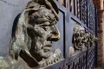 dramatic close up of bronze heads on a cathedral in colonial district, santo domingo, dominican republic