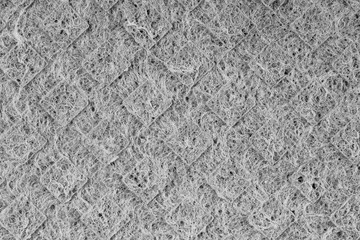 Household cleaning sponges closeup. Sponge detail texture, sponge texture close up background. Cellulose sponge texture. Wire mesh on sponge surface background. Black and white