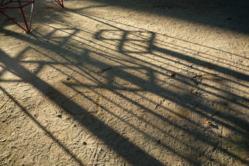 junglegym with long shadow in the park