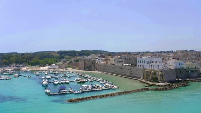 Flight over the Old town and Harbour of Otranto, Lecce province, Salento peninsula, Apulia, Italy, June 2019