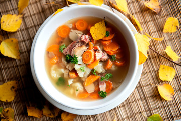 Overhead view of mushrooms soup on table 