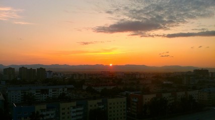 far east sunset thrue the mountain