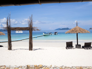 Seats with sun shelter on white sand beach sea view background, Travel plans after retirement of business people