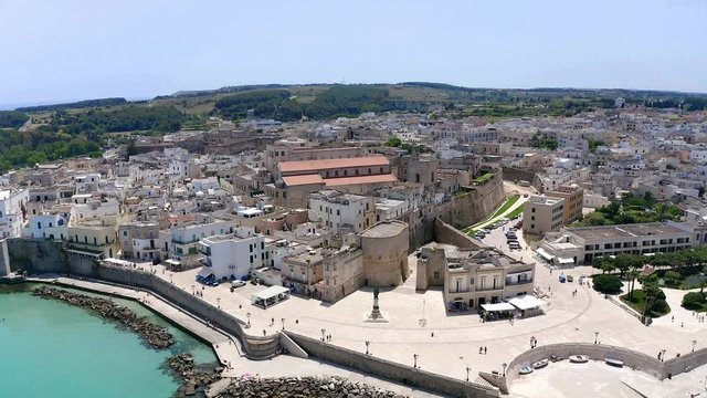 Flight over the Old town and Harbour of Otranto, Lecce province, Salento peninsula, Apulia, Italy, June 2019