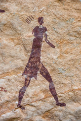 San bushman rock painting of a person hunting