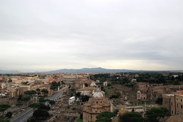 View of Colosseum and Roman Forum in Rome, Ilaly  from monument of Vittorio Emanuele (Vittoriano) observation deck. Rome cityscape from viewpoint. Travel photography.