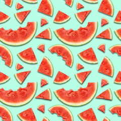 Watermelon pieces seamless pattern on blue background. flat lay. top view