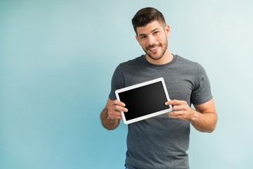 Attractive Young Male Showing Wireless Technology