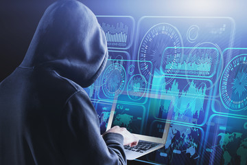 Hacker with laptop, HUD digital interface