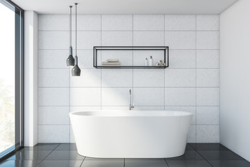 White tile bathroom interior with tub