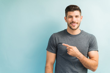 Attractive Male Is Gesturing In Studio
