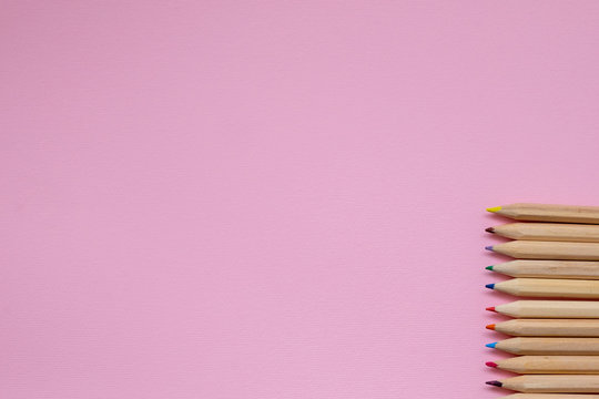 a set of colored pencils on a gray concrete background. Concept back to school 3x8 banner