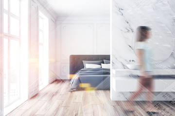 Woman in luxury marble bedroom and bathroom