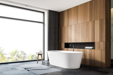 Fototapeta na wymiar Grey tile floor panoramic bathroom corner with tub