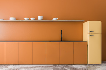 Orange kitchen interior with yellow fridge