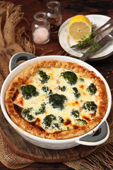 French pie -traditional open pie with salmon, broccoli, egg, cheese and sour cream.