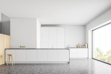 Interior of modern kitchen with counters and bar