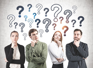 Thoughtful business team, question marks