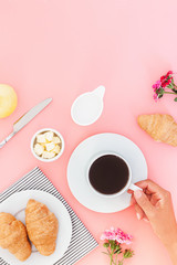 Morning breakfast coffee and croissant, butter, orange juice and