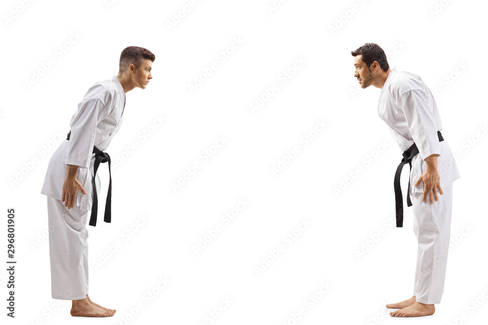 Sticker Young men in karate kimonos bowing to eachother