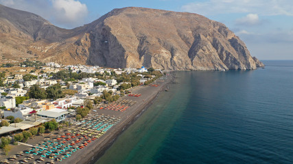 Naklejka na ściany i meble Aerial drone photo of famous volcanic beach and bay of Perissa village, Santorini island, Cyclades, Greece