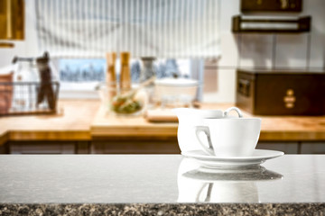 Kitchen table top with empty space for you products or decoration and blurred kitchen furniture background.