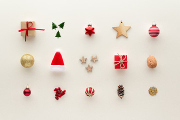Christmas composition. Santa hat star gift bauble pine cone elements set top view background with...