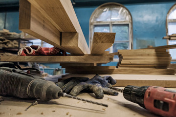 Woodworking workshop of carpenters with different types of plank.