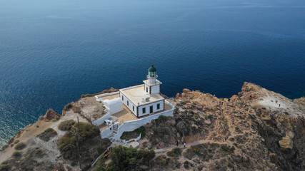 Aerial drone photo of iconic lighthouse of Akrotiri near Akrotiri village, Santorini island,...