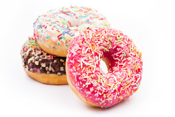 Delicious sweet donuts on black background