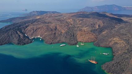 Aerial drone top down photo of iconic main Crater of Santorini volcanic island called Kameni...