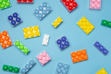 Various colorful toy blocks background. Many assorted building bricks. Flat lay. top view