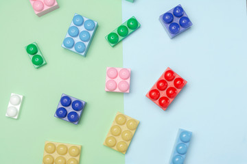 Toy bricks / Pile of child's building blocks in multiple colours / Flat lay / Top view